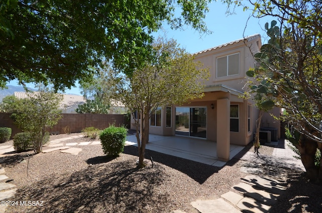 back of property with a patio area