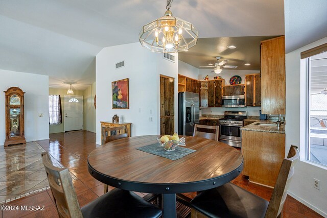 kitchen with a ceiling fan, light stone countertops, stainless steel appliances, a sink, and recessed lighting