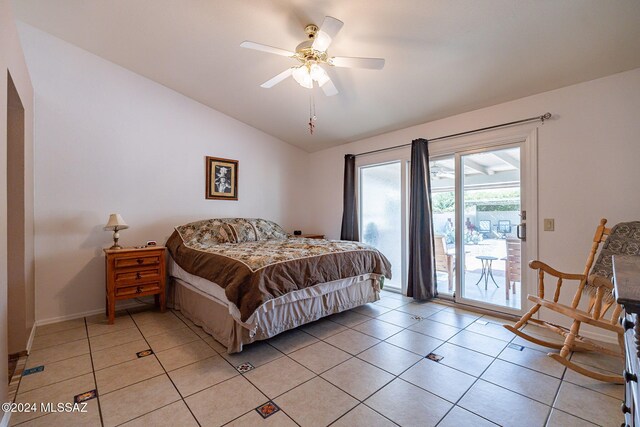 bedroom featuring baseboards, a ceiling fan, light wood-style flooring, vaulted ceiling, and a closet