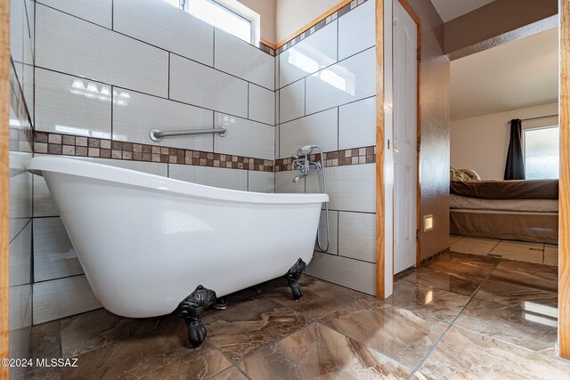 washroom featuring cabinet space, visible vents, and washer and clothes dryer