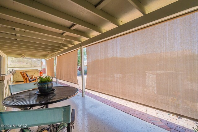 doorway to property featuring a tile roof and stucco siding