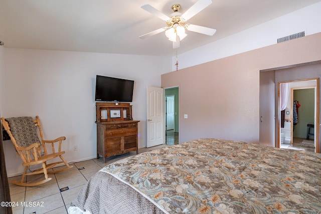 bedroom featuring lofted ceiling, light tile patterned floors, ceiling fan, and visible vents