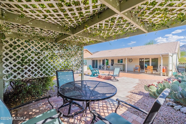 view of patio / terrace featuring an outdoor fire pit