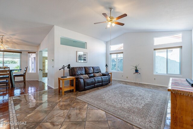 rear view of property featuring a fenced backyard, a mountain view, a fire pit, a tiled roof, and a patio area