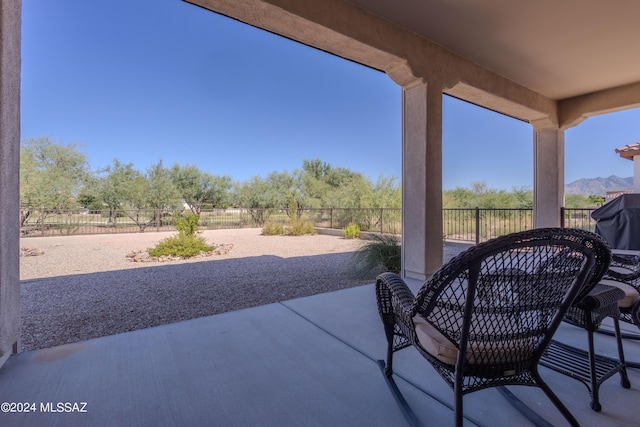 view of patio / terrace with a mountain view