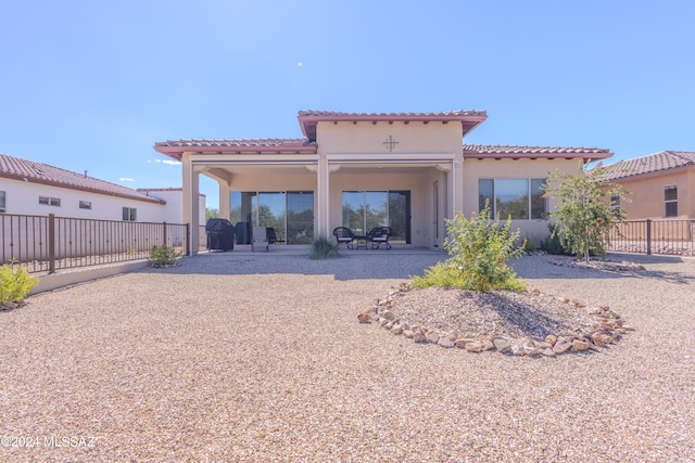 rear view of property with a patio