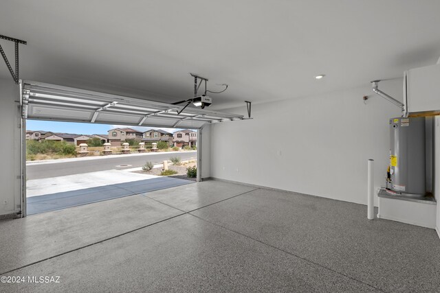 garage with a garage door opener and gas water heater