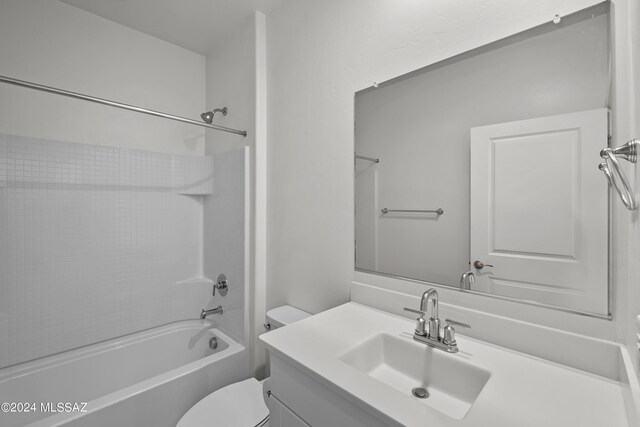 full bathroom with  shower combination, vanity, and toilet