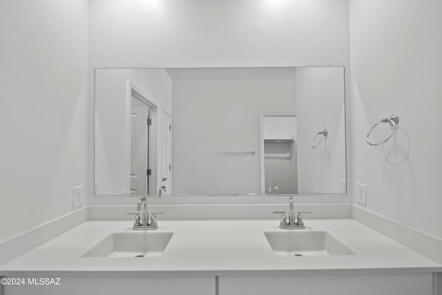 bathroom with double vanity and a sink