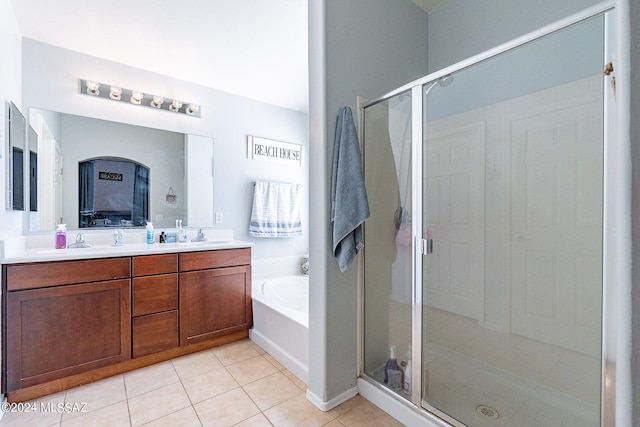 bathroom with independent shower and bath, vanity, and tile patterned flooring