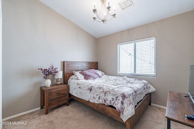 bedroom with vaulted ceiling, a chandelier, and light colored carpet