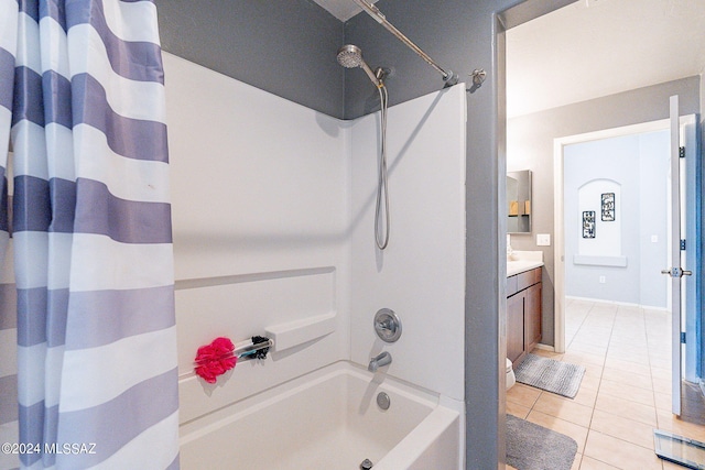 bathroom with tile patterned floors, shower / tub combo, and vanity