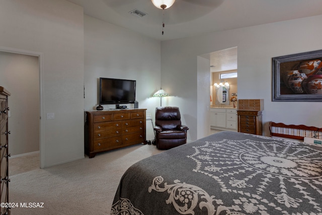 carpeted bedroom featuring ceiling fan and connected bathroom