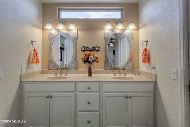 bathroom featuring vanity and a healthy amount of sunlight