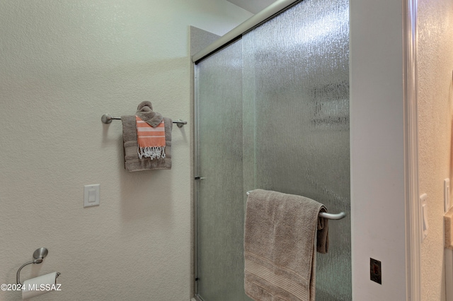 bathroom with an enclosed shower