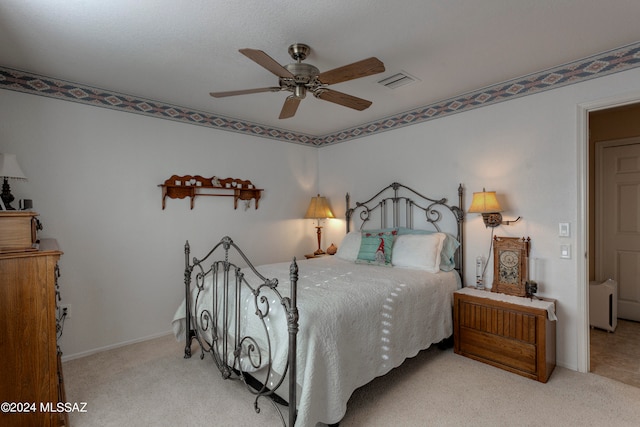 bedroom featuring ceiling fan and light colored carpet