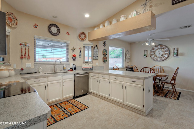 kitchen with sink, white cabinetry, kitchen peninsula, ceiling fan, and stainless steel dishwasher