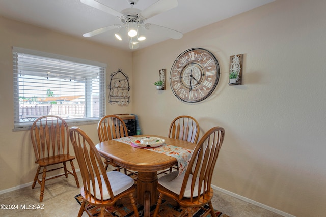 dining room with ceiling fan and light tile patterned floors