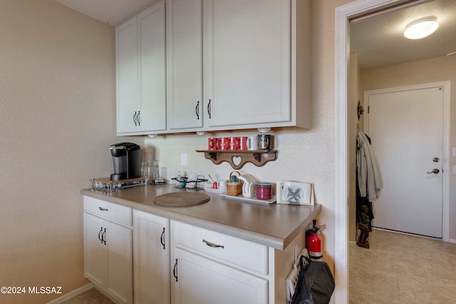 kitchen featuring white cabinetry