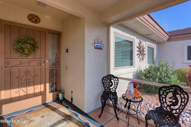 property entrance with covered porch