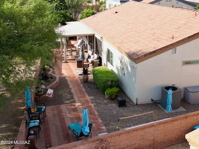 view of home's exterior featuring central AC unit and a patio area