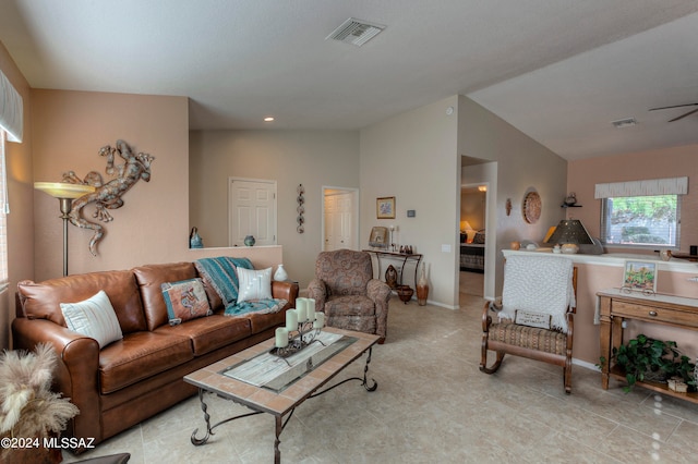 tiled living room with lofted ceiling