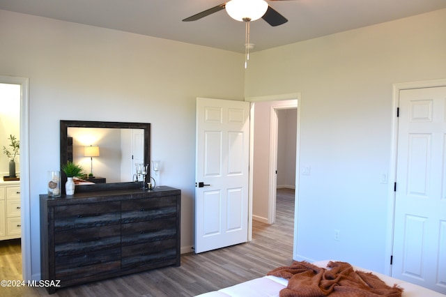 bedroom featuring hardwood / wood-style floors and ceiling fan