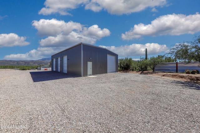 view of outbuilding with an outbuilding and a mountain view