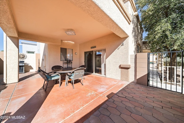 view of patio / terrace with grilling area and outdoor dining area