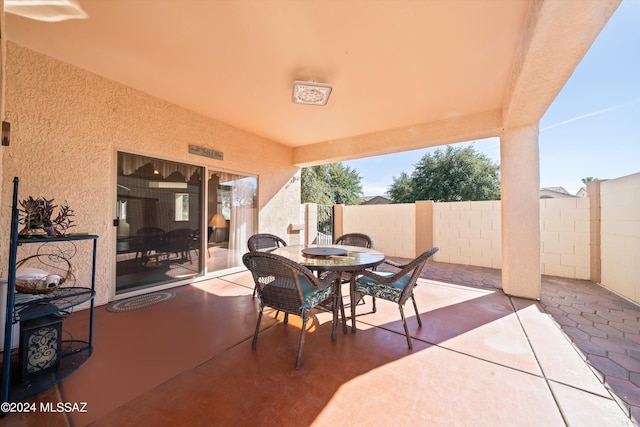 view of patio / terrace featuring fence and outdoor dining space
