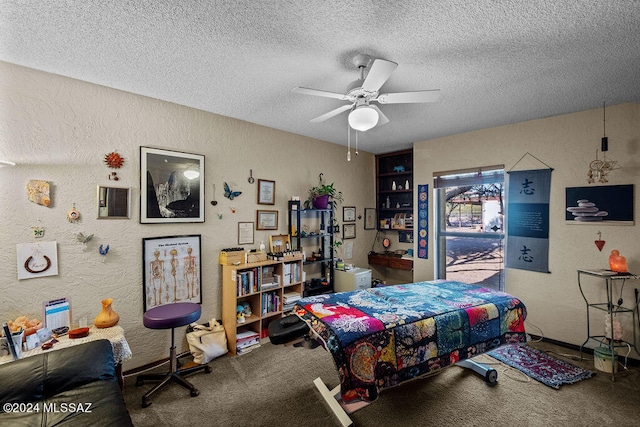 bedroom with a textured ceiling, carpet flooring, and ceiling fan