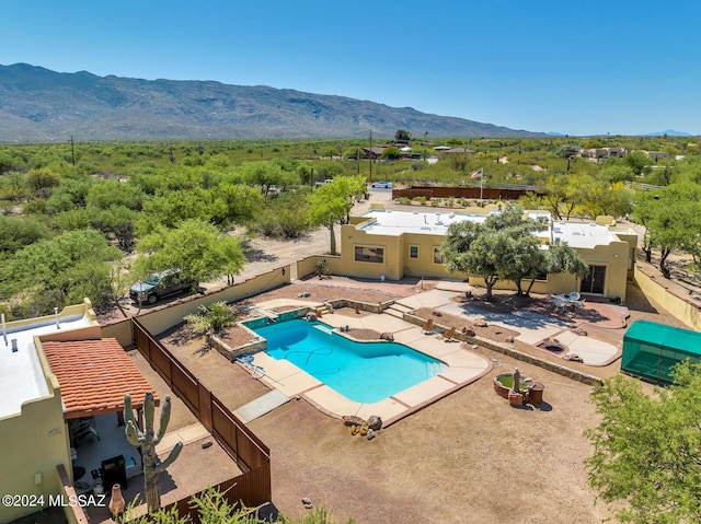 view of pool with a mountain view and a patio area