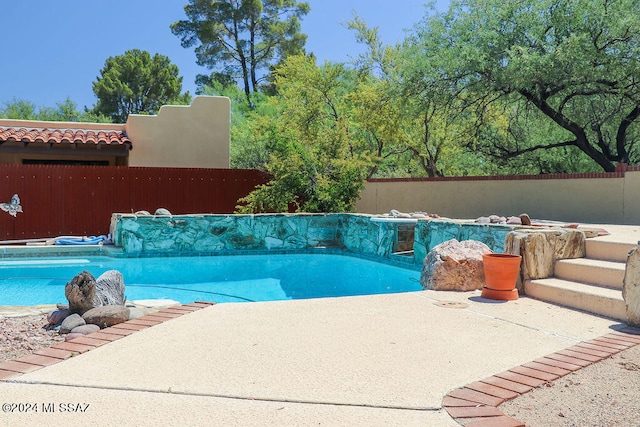 view of pool featuring a patio area