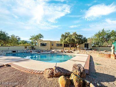 view of swimming pool with a patio area