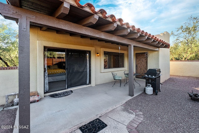 entrance to property with a patio