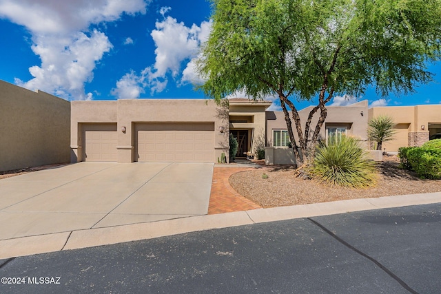 southwest-style home with a garage