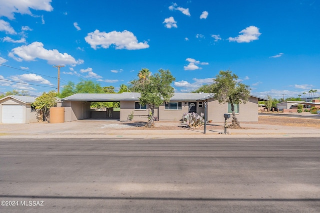 view of front of property with a carport