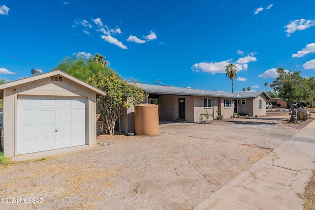 ranch-style home with a garage