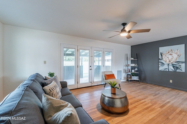 living room featuring ceiling fan, french doors, and light hardwood / wood-style flooring