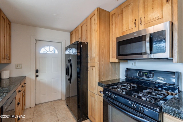 kitchen with black appliances and light tile patterned floors