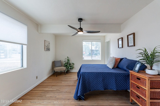 bedroom with light wood-type flooring and ceiling fan