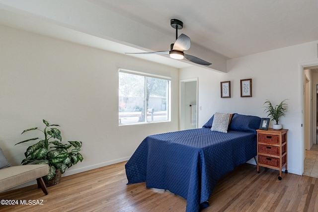 bedroom with ceiling fan and hardwood / wood-style flooring