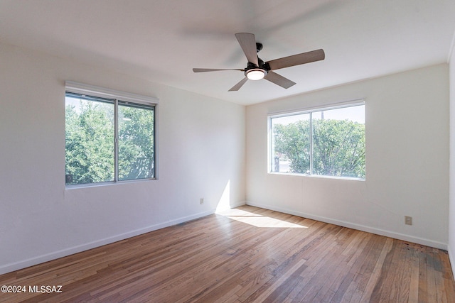 unfurnished room with ceiling fan and light wood-type flooring