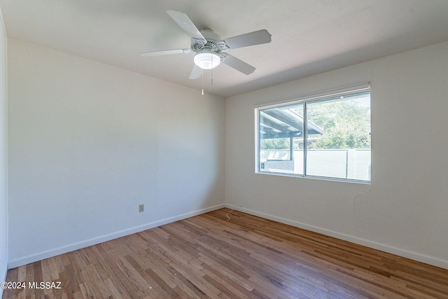 unfurnished room with wood-type flooring and ceiling fan