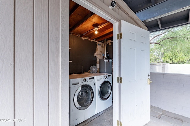 washroom with separate washer and dryer and gas water heater