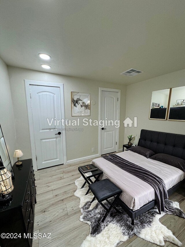 bedroom featuring light wood-type flooring