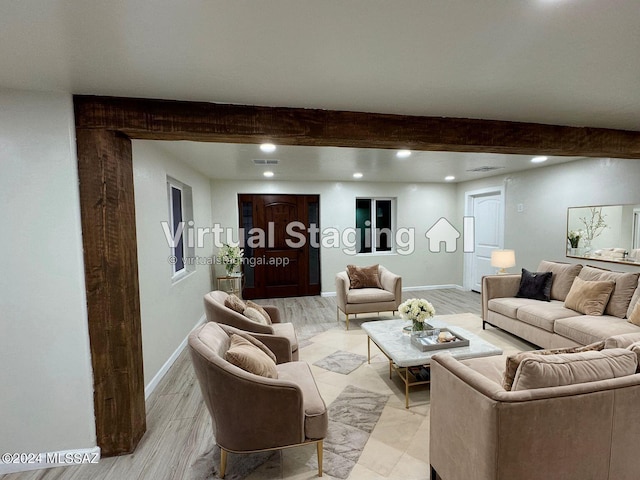 living room featuring light wood-type flooring and beam ceiling