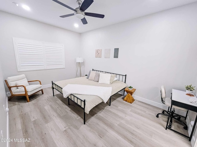 bedroom with ceiling fan and light wood-type flooring