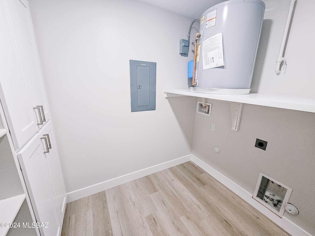 washroom with washer hookup, light hardwood / wood-style floors, electric panel, electric dryer hookup, and hookup for a gas dryer