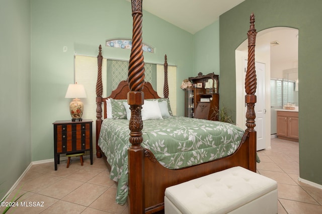 tiled bedroom featuring ensuite bathroom